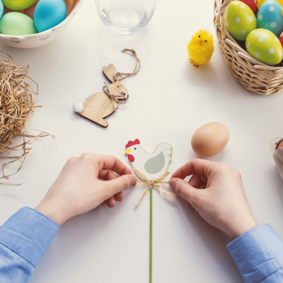 person tying knot on chicken decor 1040161