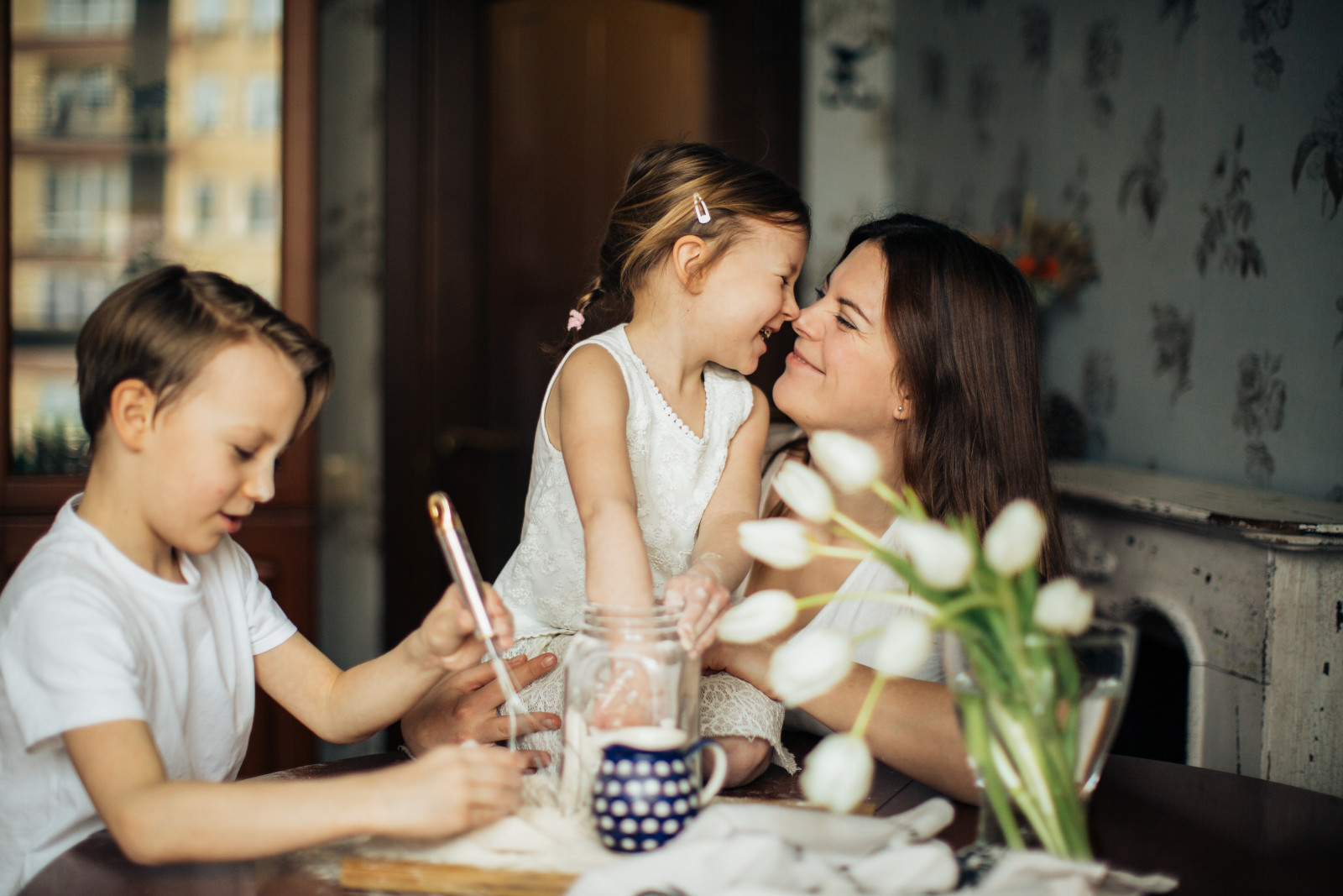photo of woman playing with her children 3806953